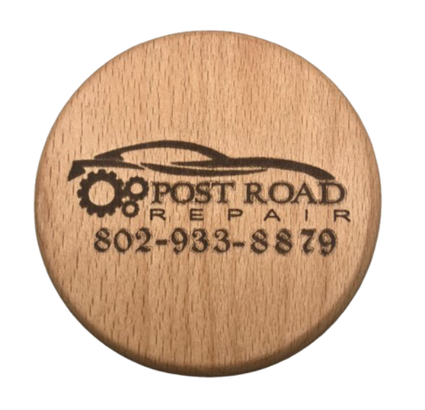 engraved wood coaster for an auto body shop. This coaster says "post road repair" on it.