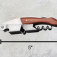 Dimensions of the engraved stainless steel corkscrew with wooden handle. 5 inches long
