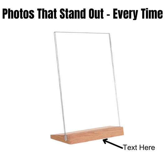 Clear acrylic sign holder with a smooth engraved wood base, showcasing its elegant minimalist design on a clean white background.
