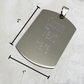 Stainless steel pendant with dimensions labeled: 2 inches tall, 1 inch wide, and 1/16 inch thick.