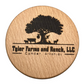 Engraved wooden coaster designed for a corporate bulk order. The coaster features a custom engraving reading 'Tyler Farms and Ranch, LLC' company logo on it.