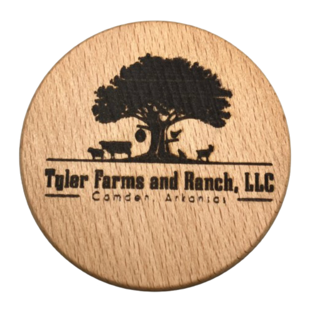 Engraved wooden coaster designed for a corporate bulk order. The coaster features a custom engraving reading 'Tyler Farms and Ranch, LLC' company logo on it.