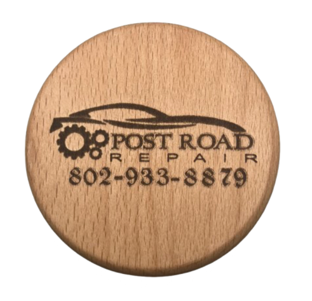 engraved wood coaster for an auto body shop. This coaster says "post road repair" on it. 