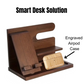 Wooden desk organizer with compartments for phone, wallet, glasses, pens, and watch, paired with an engraved wooden AirPods Pro 2 case, displayed together.