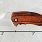 Pocket knife with engraved wood handle – compact, lightweight, and easy to carry. Dimensions included.
